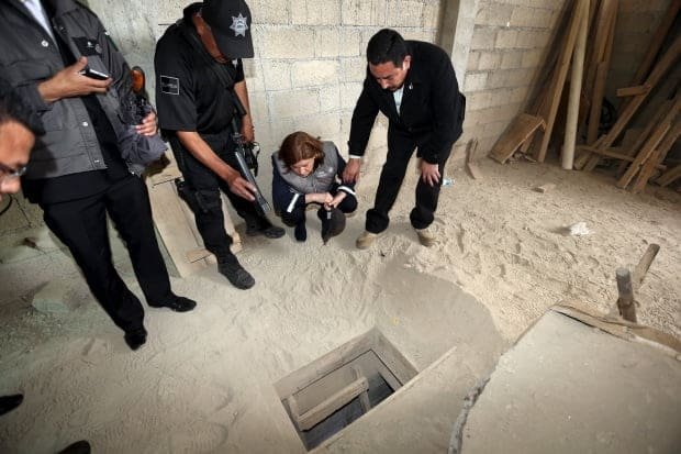 Mexico's Attorney General Arely Gomez Gonzalez looks into the tunnel drug lord Joaquin 'El Chapo' Guzman used to escape a maximum-security prison. (Attorney General's Office/Reuters)